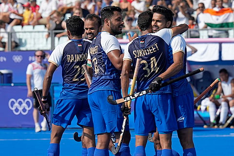 India's Abhishek celebrates with teammates after scoring the opening goal